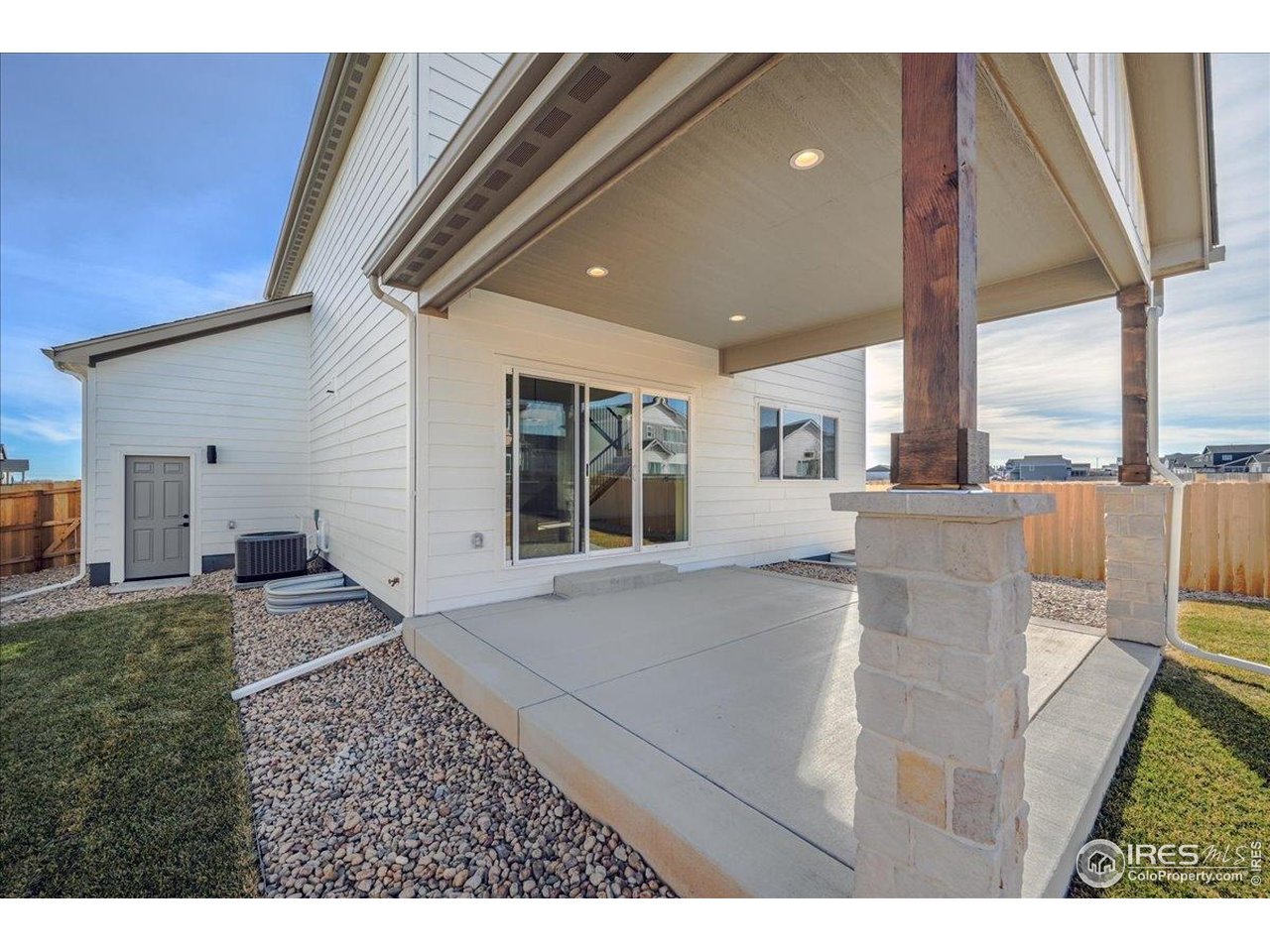 825 Doubleleaf Drive Windsor, CO 80550 - Photo 24 of 25 a view of a living room and a kitchen