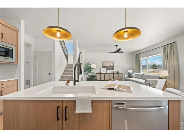 a kitchen with a counter space a sink and a stove