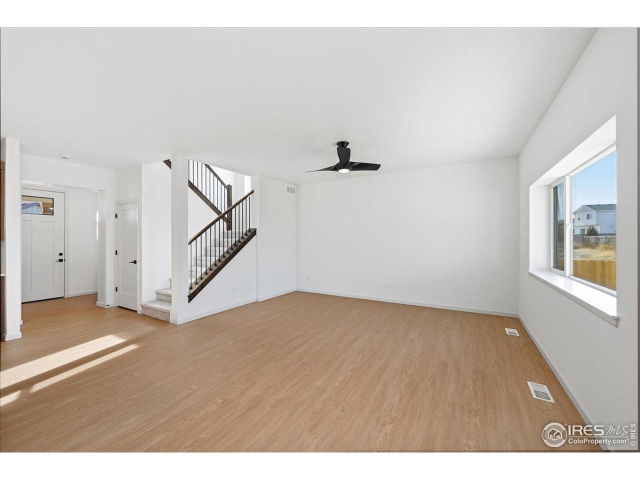 825 Doubleleaf Drive Windsor, CO 80550 - Photo 10 of 25 a view of an empty room with a window