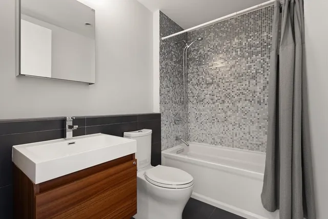 a bathroom with a sink a toilet and a bathtub