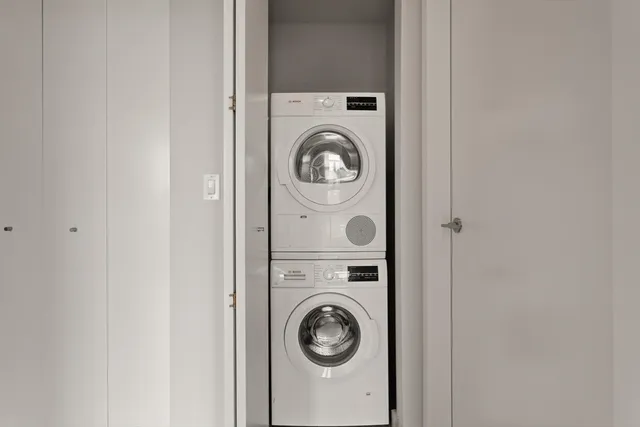a view of washer and dryer in a utility room