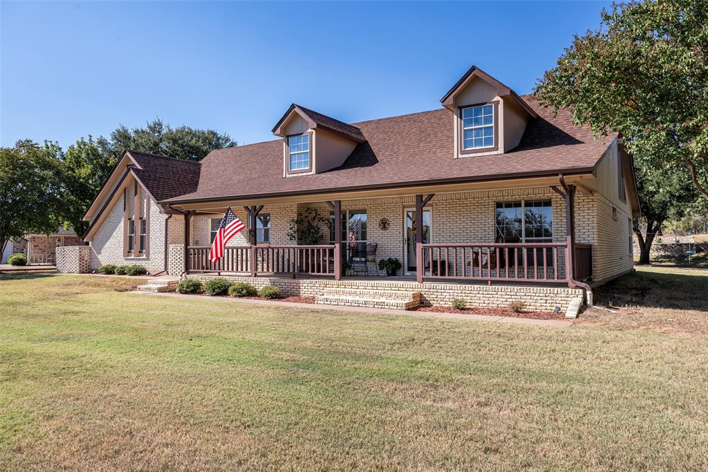 10517 Ravenswood Road Granbury, TX 76049 - Photo 2 of 35 a front view of a house with a yard