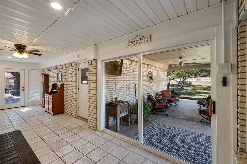 10517 Ravenswood Road Granbury, TX 76049 - Photo 25 of 35 a view of a livingroom with furniture and a ceiling fan