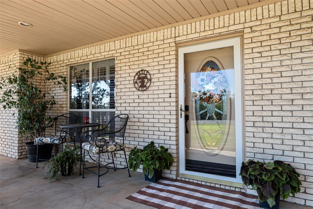 10517 Ravenswood Road Granbury, TX 76049 - Photo 3 of 35 a view of a door and a outdoor space