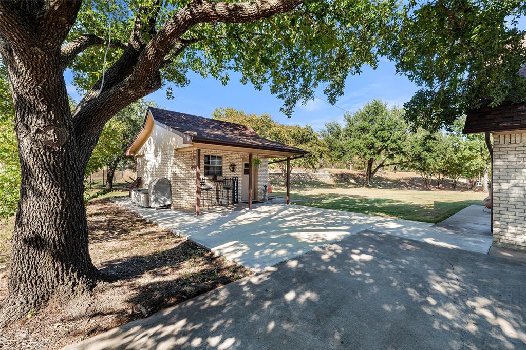10517 Ravenswood Road Granbury, TX 76049 - Photo 31 of 35 a view of a large trees with a tree in the background