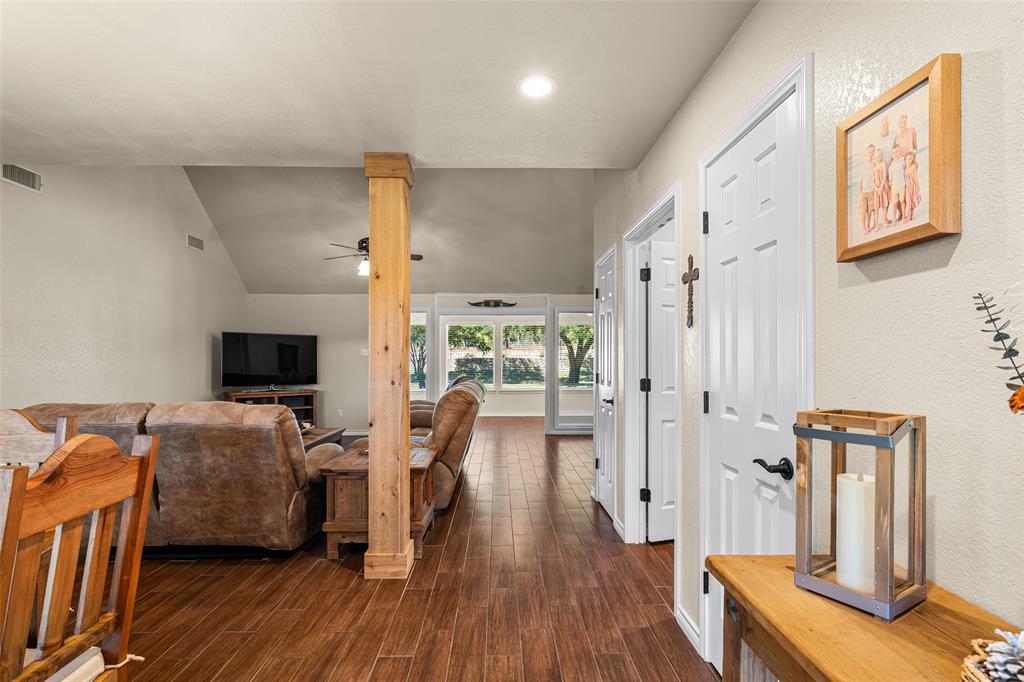 10517 Ravenswood Road Granbury, TX 76049 - Photo 4 of 35 a view of a livingroom with wooden floor
