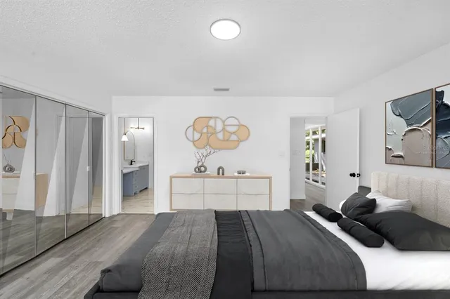 a bedroom with a bed and a dresser