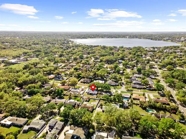 an aerial view of houses with outdoor space