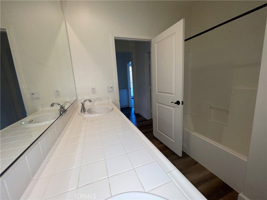 22083 Propello Drive Saugus, CA 91350 - Photo 19 of 24 a bathroom with a sink and a mirror