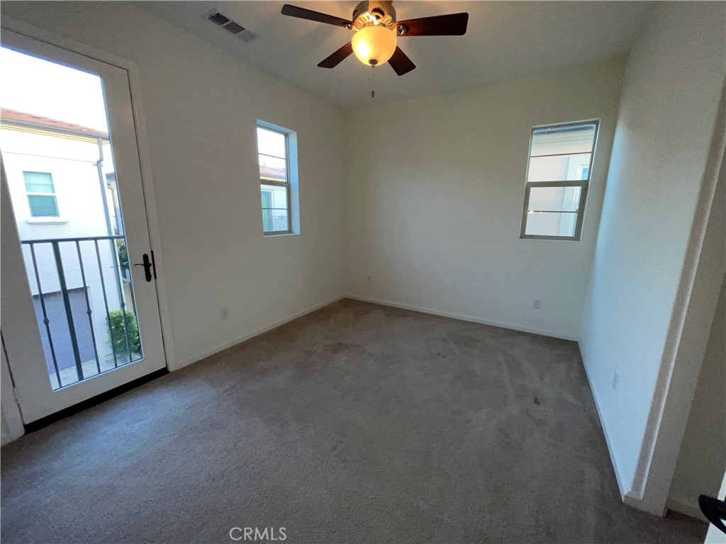 22083 Propello Drive Saugus, CA 91350 - Photo 21 of 24 an empty room with windows and fan