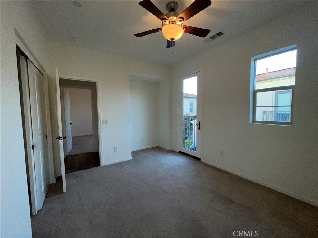 22083 Propello Drive Saugus, CA 91350 - Photo 22 of 24 an empty room with closet and a chandelier fan