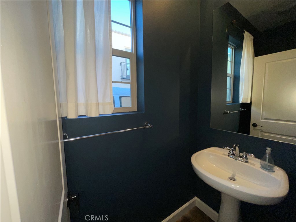 22083 Propello Drive Saugus, CA 91350 - Photo 3 of 24 a bathroom with a sink and a mirror