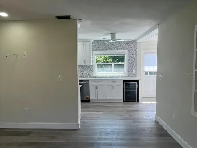 a kitchen with a stove a refrigerator and a sink