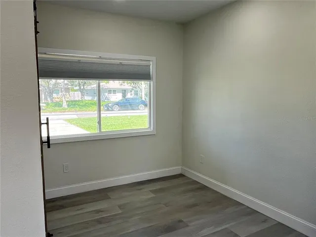 an empty room with closet area