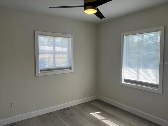 an empty room with closet area