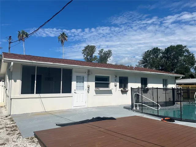 a backyard of a house with lots of green space
