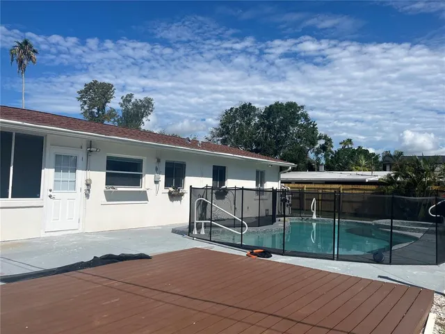 a view of a park with iron fence