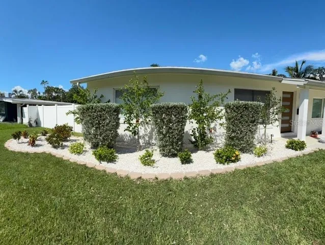 a view of a porch and yard