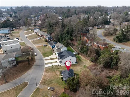 an aerial view of a house with a garden