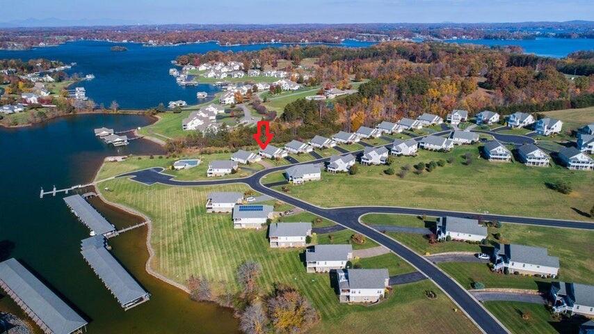 an aerial view of a house a yard swimming pool and outdoor seating