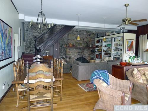 27 Vernon Road Copake, NY 12516 - Photo 4 of 10 a view of a dining room with furniture wooden floor and chandelier