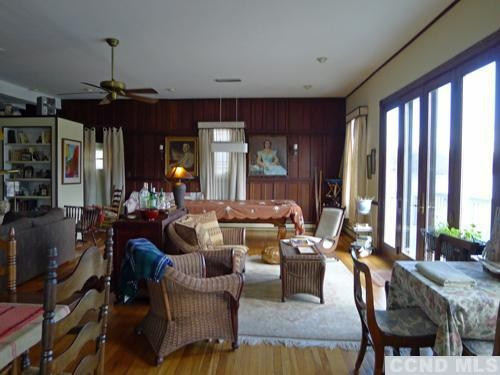 27 Vernon Road Copake, NY 12516 - Photo 5 of 10 a living room with furniture and a chandelier