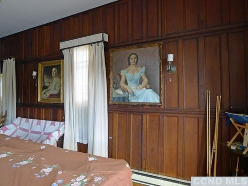 27 Vernon Road Copake, NY 12516 - Photo 9 of 10 a view of a bedroom with wooden floor and a cabinet
