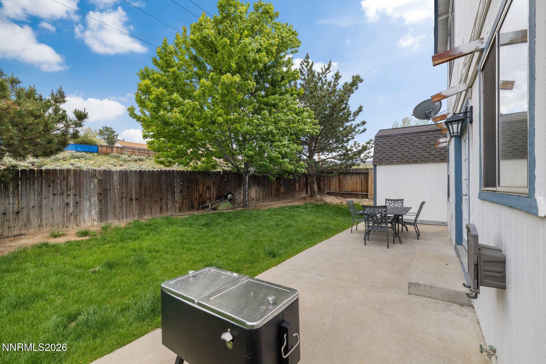 8486 Piper Place Reno, NV 89506 - Photo 35 of 80 a view of a table and chairs in the garden