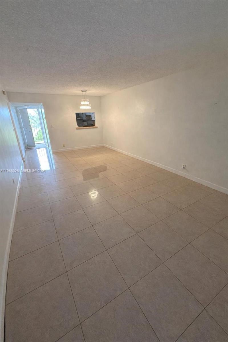 220 Southwest 9th Avenue, Unit 516 Hallandale Beach, FL 33009 - Photo 3 of 14 a view of an empty room and window