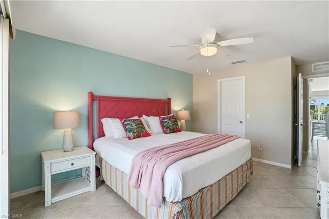 a bed room with a bed and a window