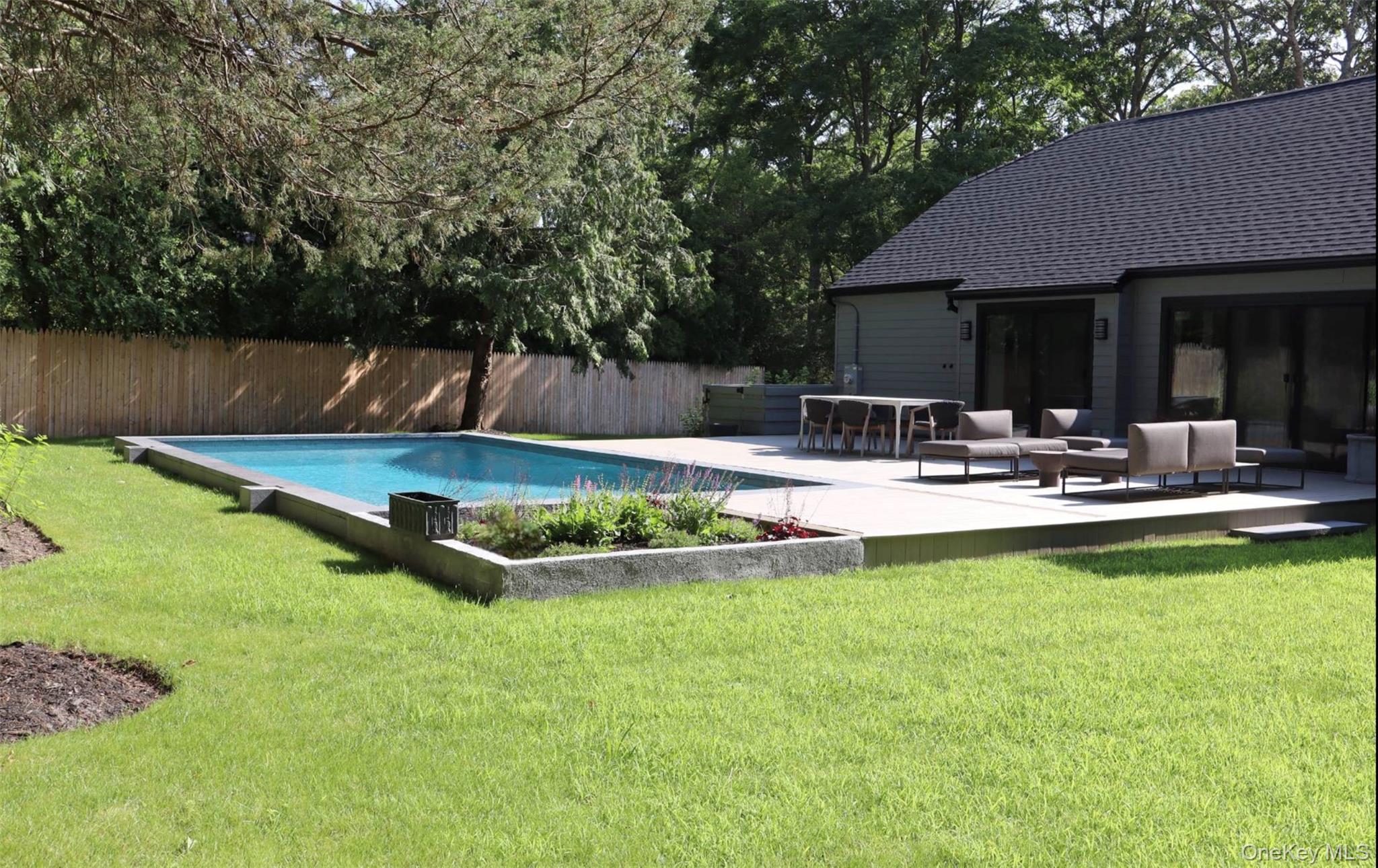 10 Hampton Street Westhampton Beach, NY 11978 - Photo 25 of 25 a view of a backyard with swimming pool