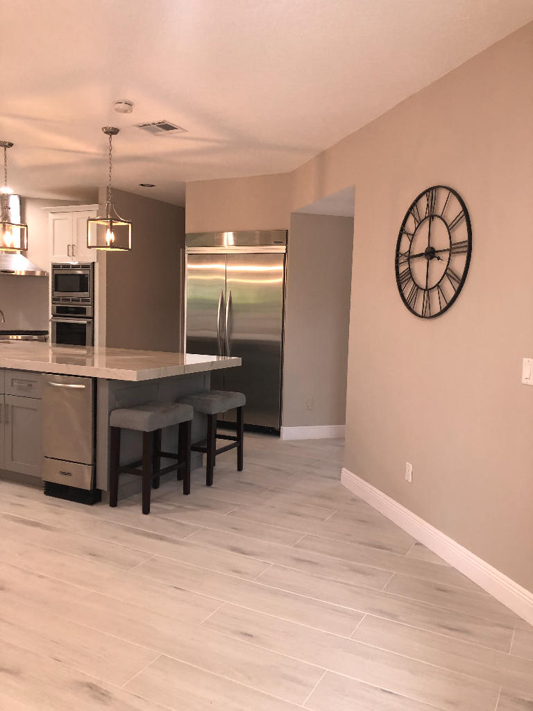 18169 Southeast Ridgeview Drive Tequesta, FL 33469 - Photo 12 of 23 a view of a room with furniture and a kitchen