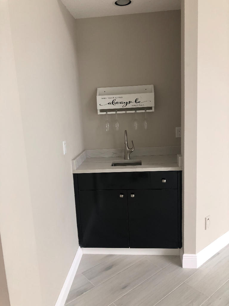 18169 Southeast Ridgeview Drive Tequesta, FL 33469 - Photo 16 of 23 a room with a sink