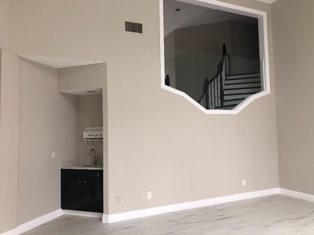 18169 Southeast Ridgeview Drive Tequesta, FL 33469 - Photo 17 of 23 a view of a livingroom with wooden floor