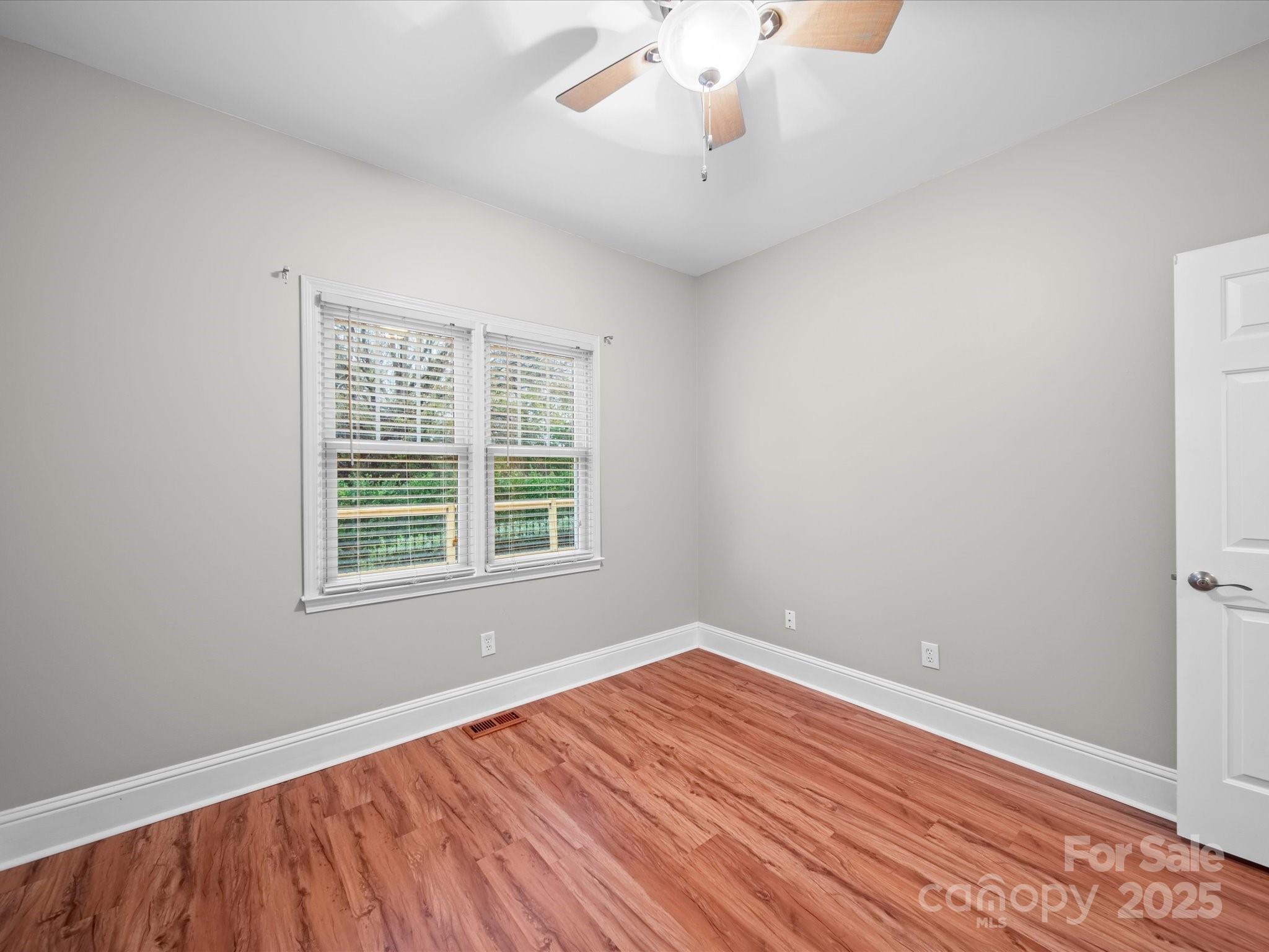 209 Chesterfield Canal Fort Mill, SC 29708 - Photo 11 of 24 an empty room with wooden floor and windows