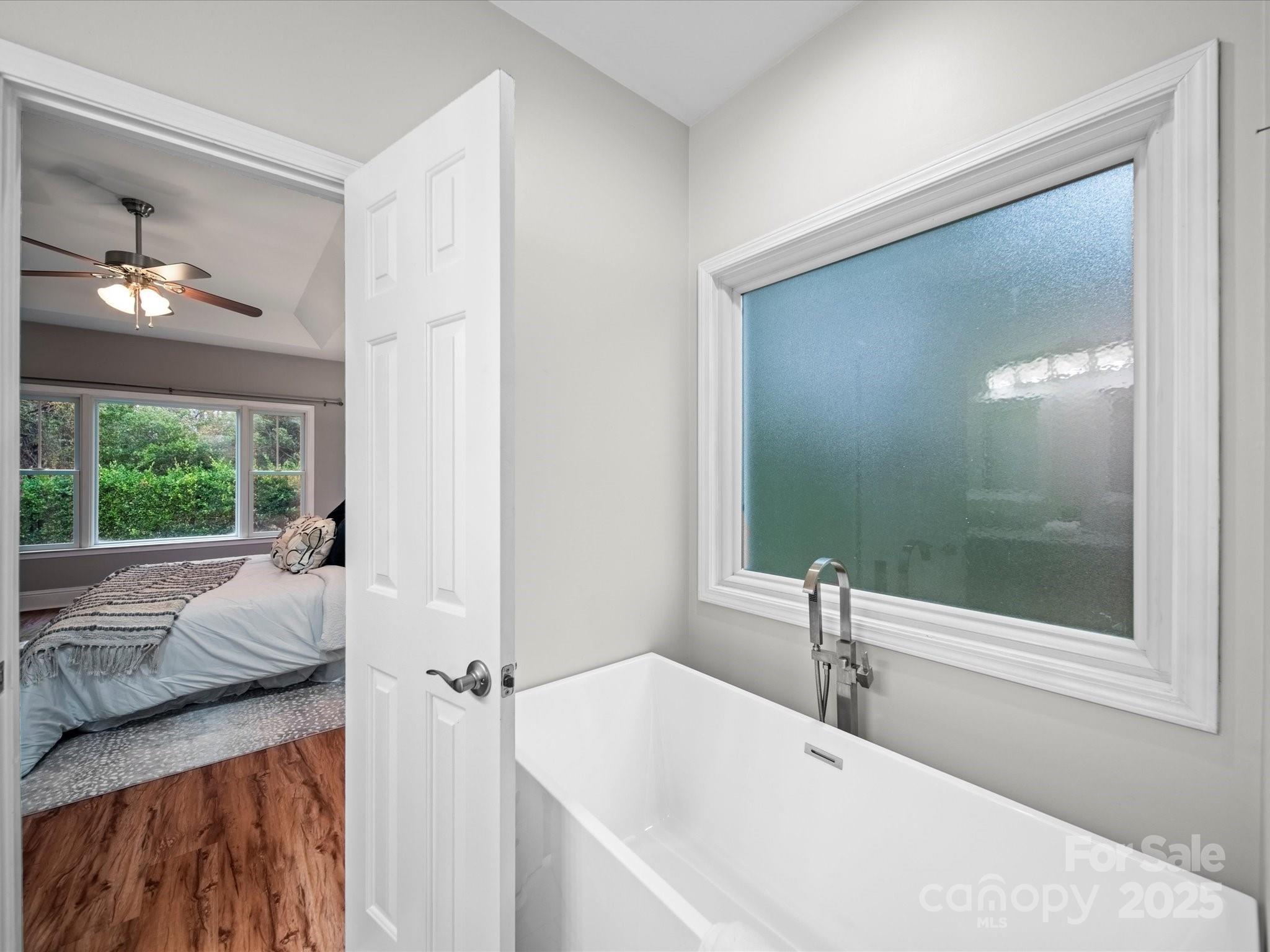 209 Chesterfield Canal Fort Mill, SC 29708 - Photo 15 of 24 a bathroom with a tub and a large window