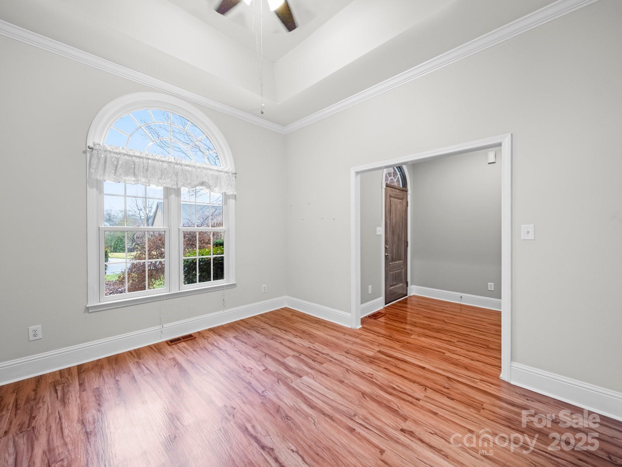 209 Chesterfield Canal Fort Mill, SC 29708 - Photo 3 of 24 an empty room with wooden floor and windows