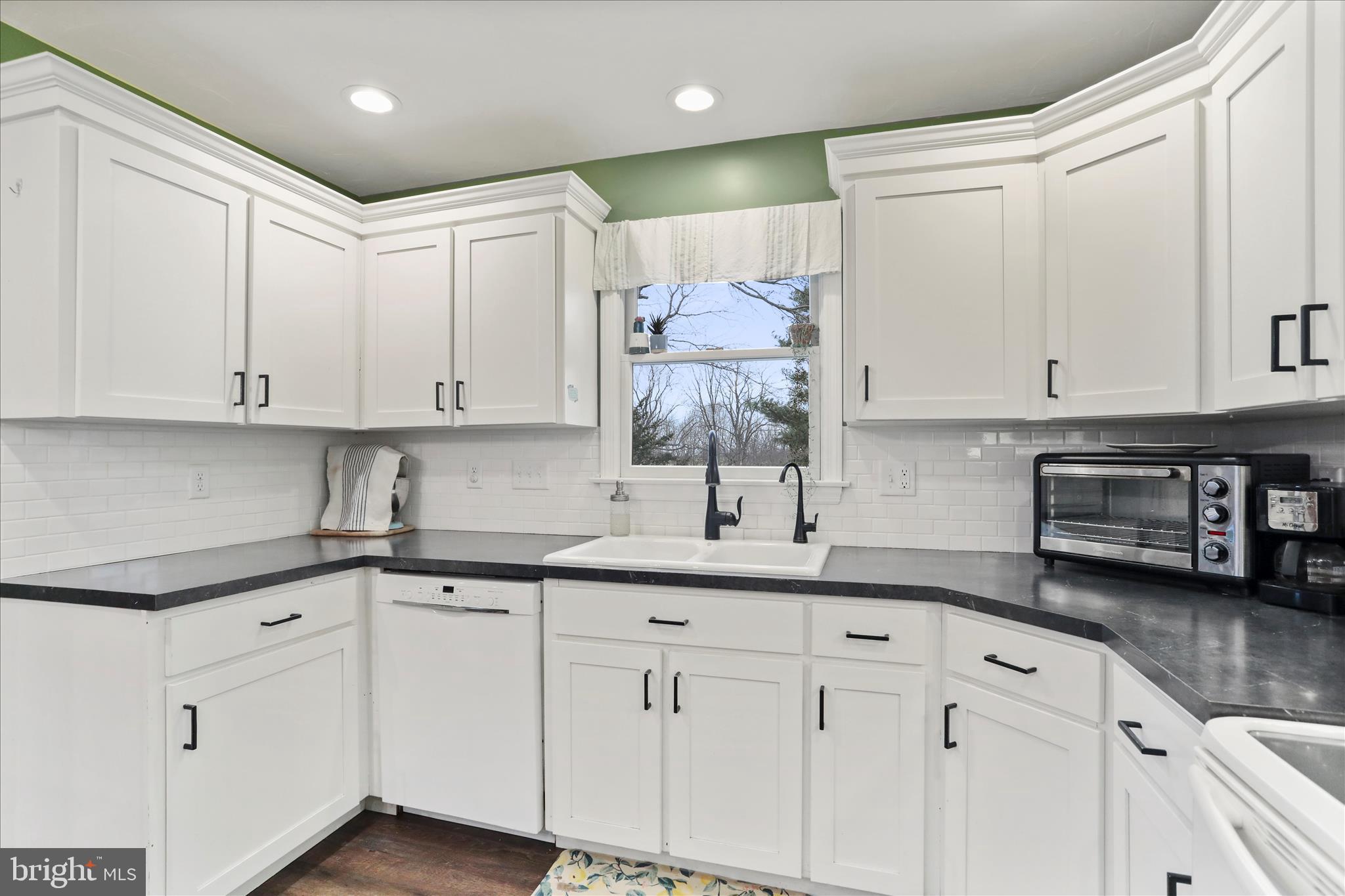 4747 Church Road Chambersburg, PA 17202 - Photo 12 of 49 a kitchen with granite countertop white cabinets and white appliances