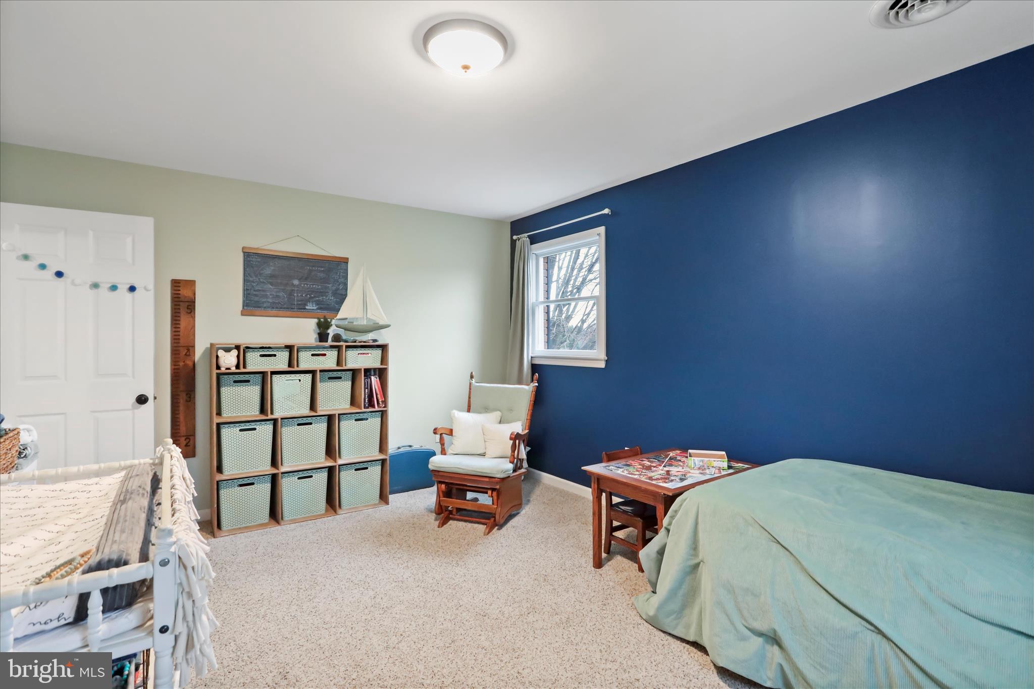 4747 Church Road Chambersburg, PA 17202 - Photo 18 of 49 a bedroom with a bed and a book shelf