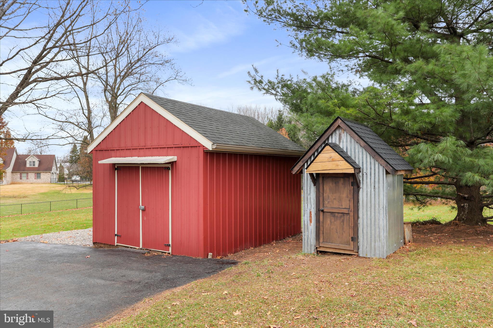 4747 Church Road Chambersburg, PA 17202 - Photo 42 of 49 a front view of a house with a yard and garage