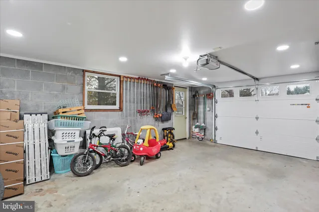 a view of a garage with a bike and a car