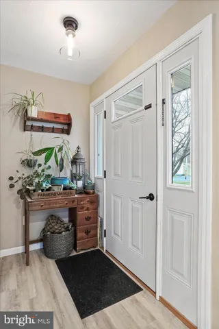 a view of room with furniture and wooden floor