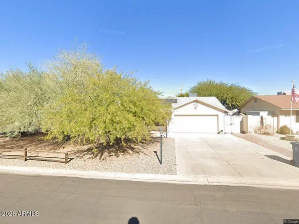 a view of a house with a street