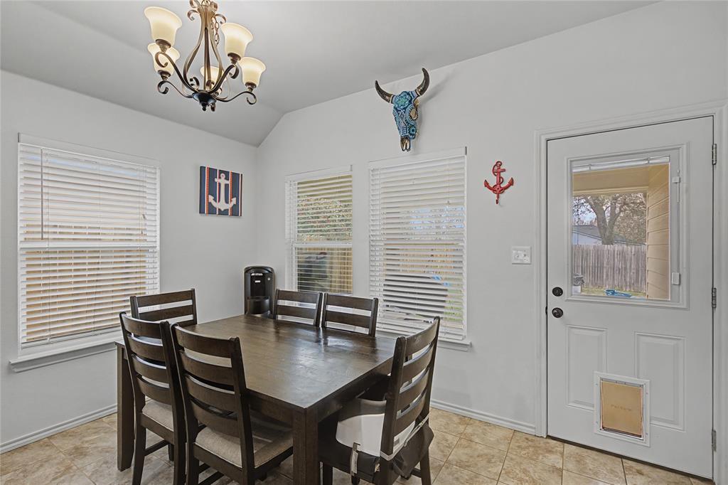 208 Lovers Path Drive Springtown, TX 76082 - Photo 12 of 35 a view of a dining room with furniture and wooden floor