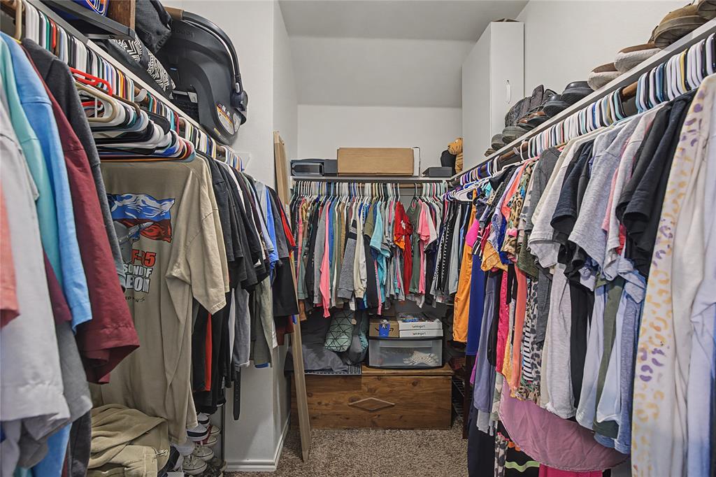208 Lovers Path Drive Springtown, TX 76082 - Photo 19 of 35 a view of walk in closet with clothes