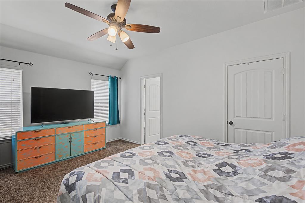 208 Lovers Path Drive Springtown, TX 76082 - Photo 20 of 35 a bedroom with bed and flat screen tv