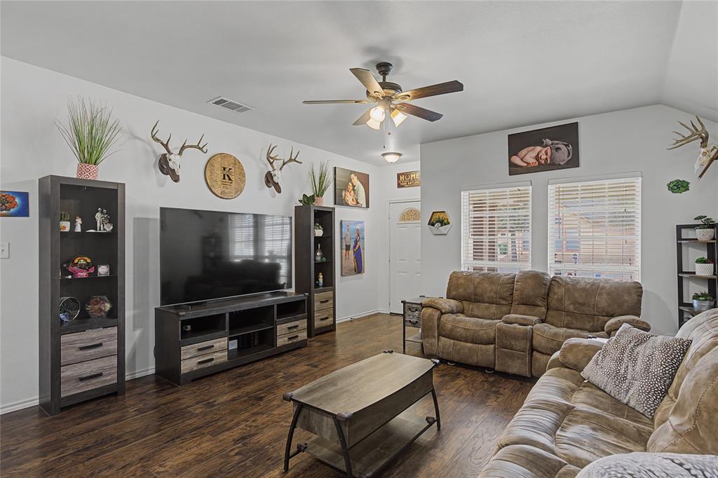 208 Lovers Path Drive Springtown, TX 76082 - Photo 2 of 35 a living room with furniture and a flat screen tv