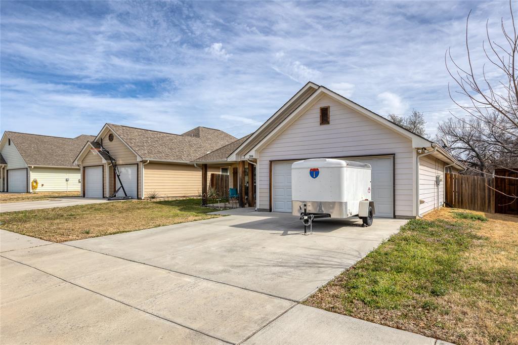208 Lovers Path Drive Springtown, TX 76082 - Photo 27 of 35 a front view of a house with a yard