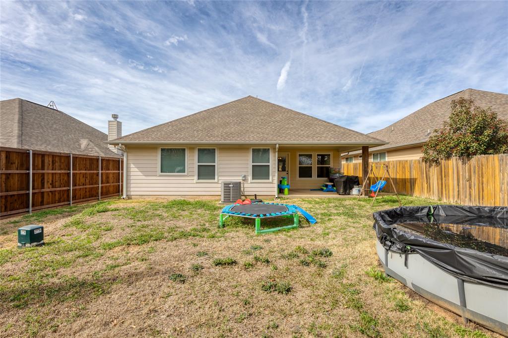 208 Lovers Path Drive Springtown, TX 76082 - Photo 28 of 35 a front view of a house with garden