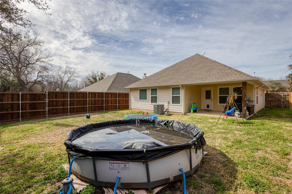 208 Lovers Path Drive Springtown, TX 76082 - Photo 30 of 35 a view of a house with backyard and sitting area